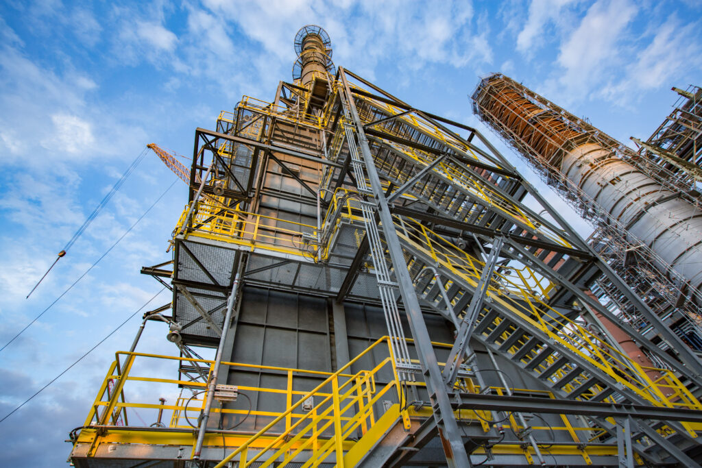 Industrial view of CORU refining unit with pipelines and processing systems at Gazprom Neft Moscow Refinery